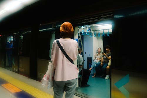 Woman near Metro Train on Station