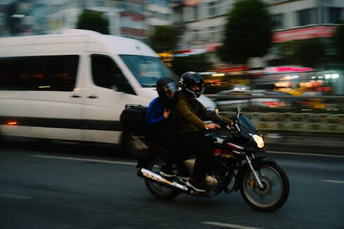 People Riding a Motorcycle
