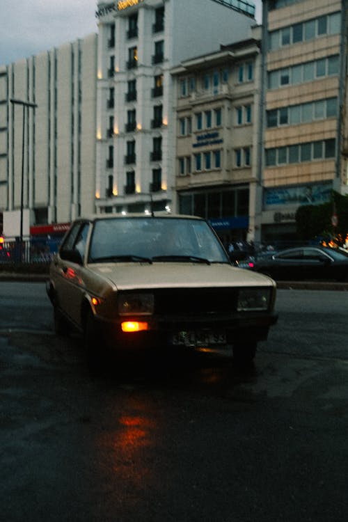 Car Turning on City Street