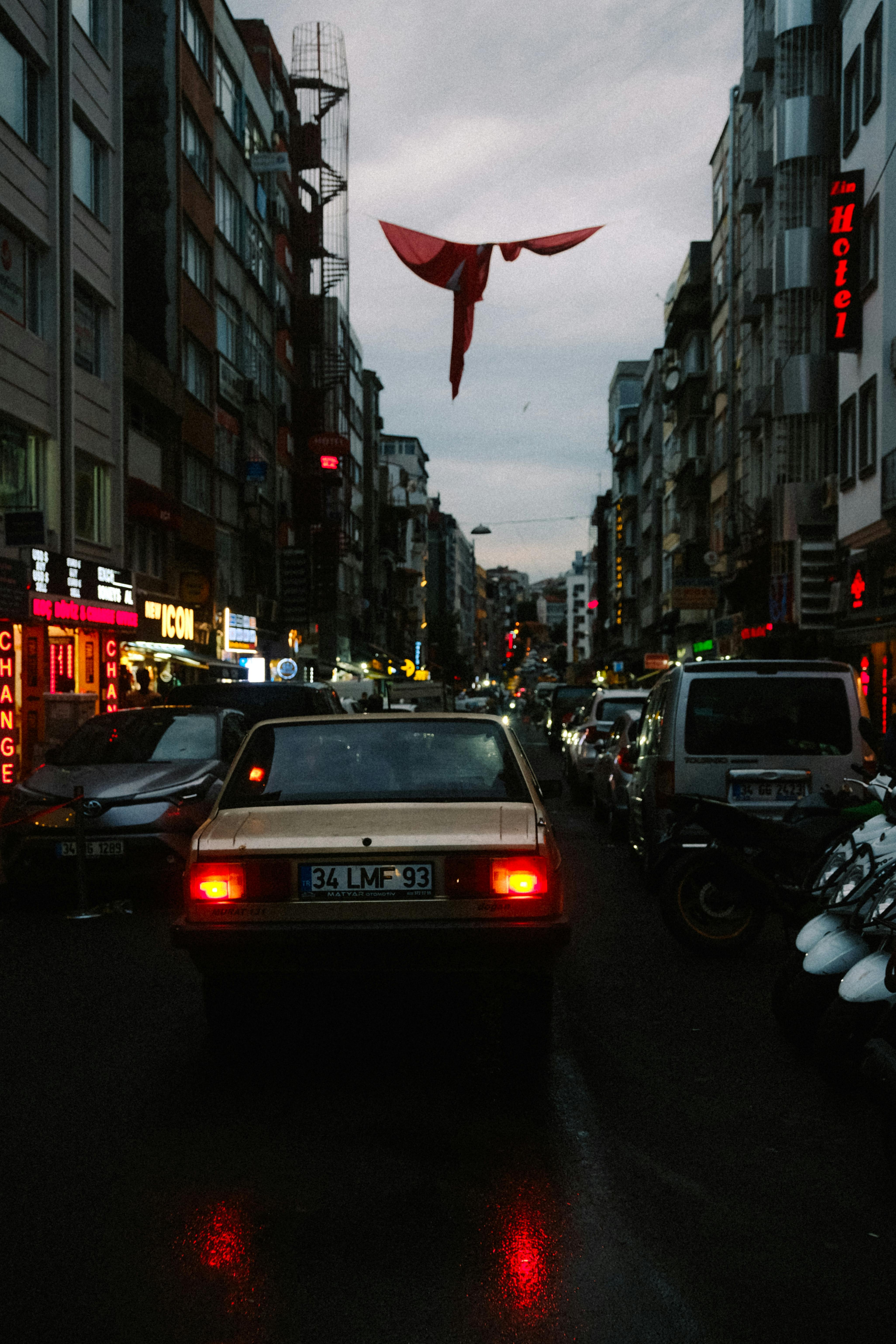 cars driving on city street at night