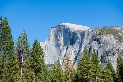 Free Stunning view of Half Dome in Yosemite National Park under a clear blue sky. Stock Photo