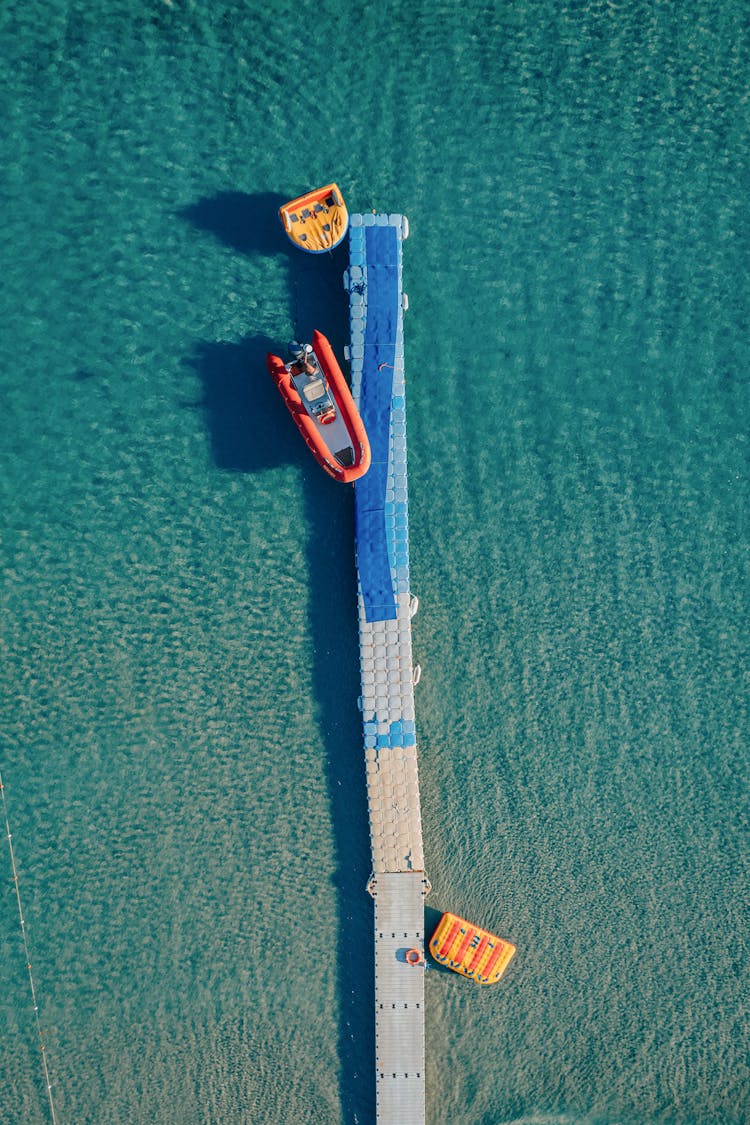 Aerial Photography Of Inflatable Floating Dock And Boat