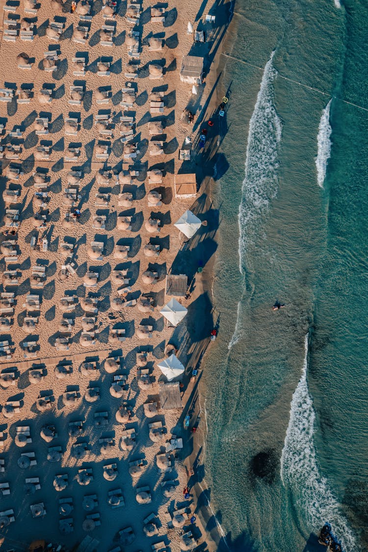 Drone Shot Of Beach With Umbrellas