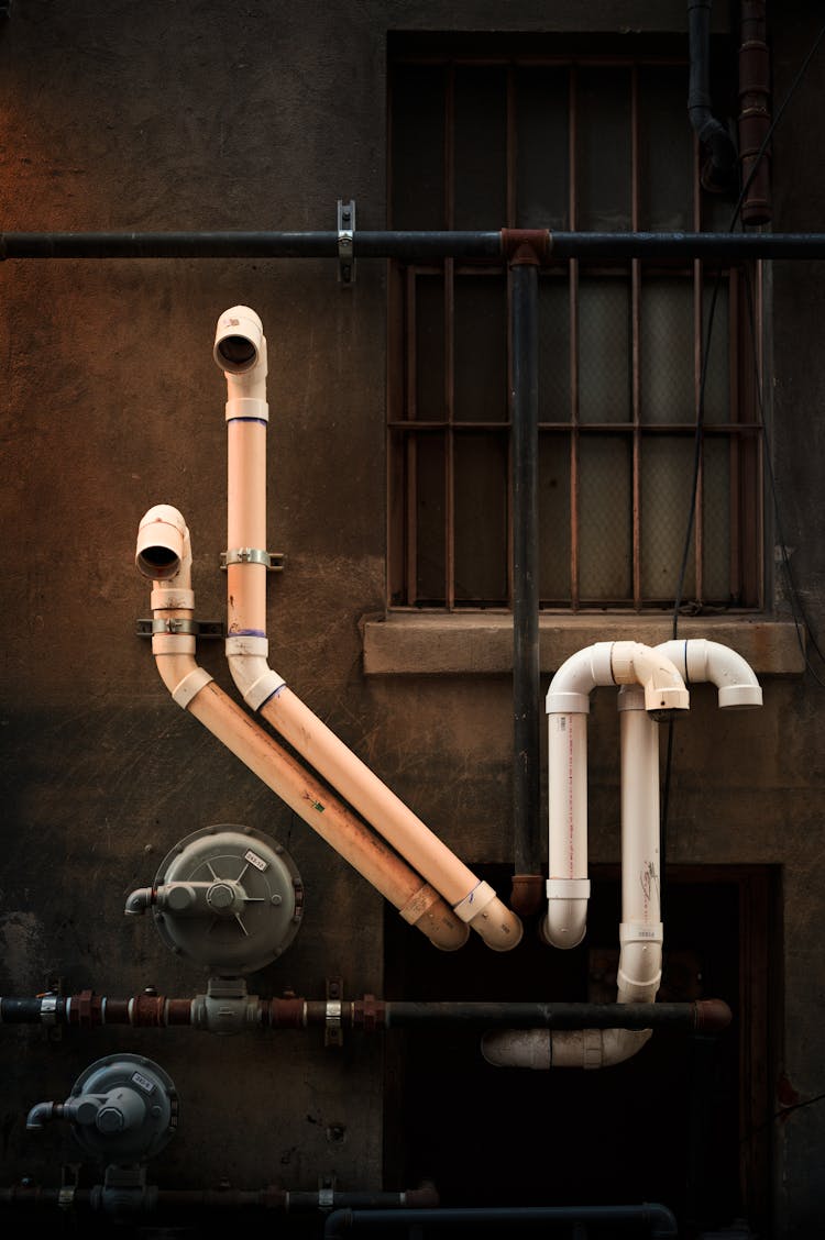 Pipes Instalation On Building Wall