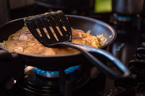 Free Black Spatula On Black Frying Pan Stock Photo