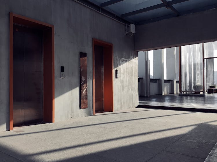 Shadows And Sunlight On Wall With Elevators