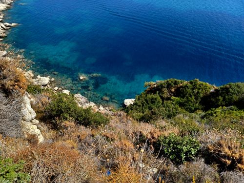 Free Stunning aerial view of Corfu's clear blue waters and lush green coastline. Stock Photo