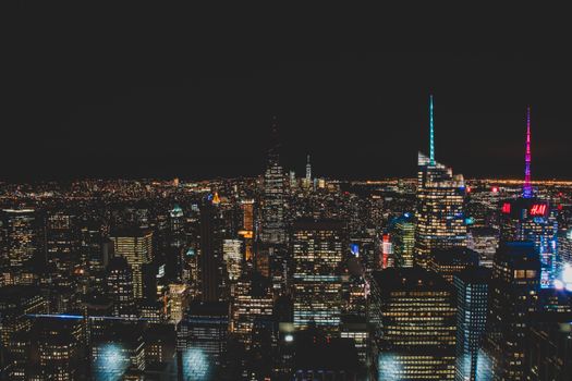 A breathtaking aerial view of New York City's illuminated skyline at night.