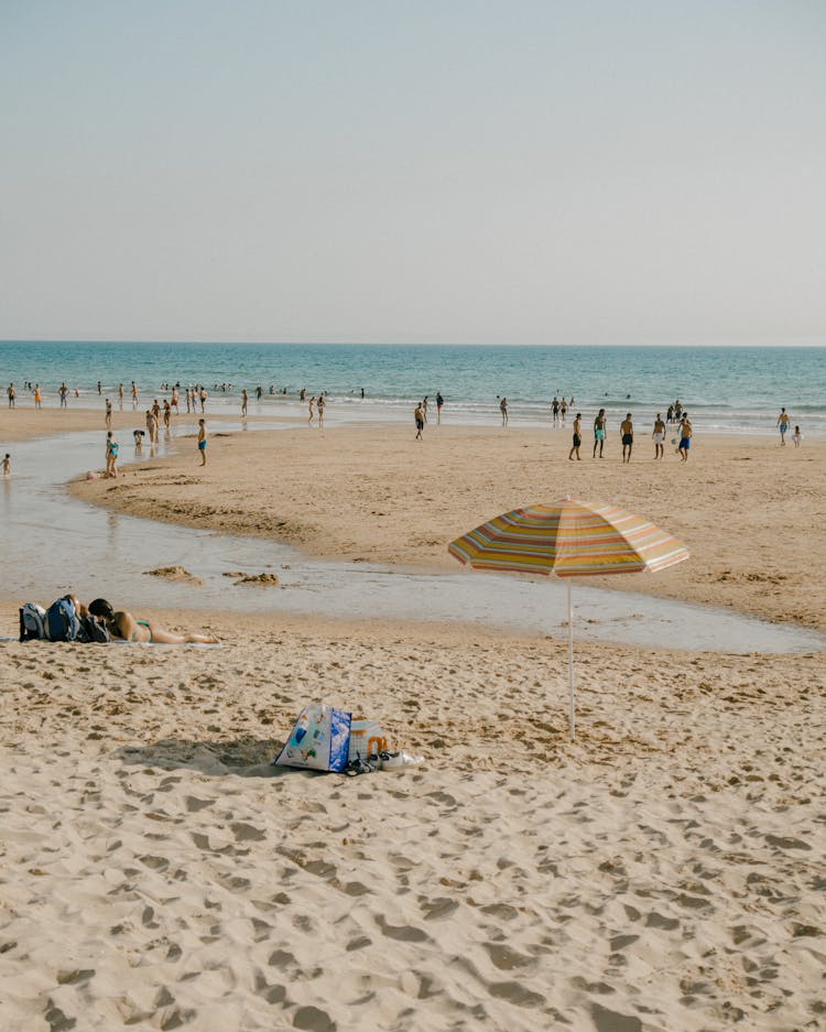 People Spending Time At A Beach