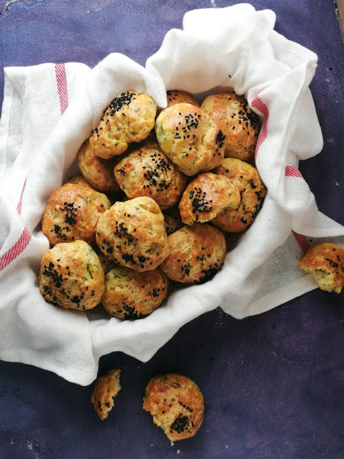 Free Close-up Photo of Puff Breads with Black Sesame Seeds Stock Photo