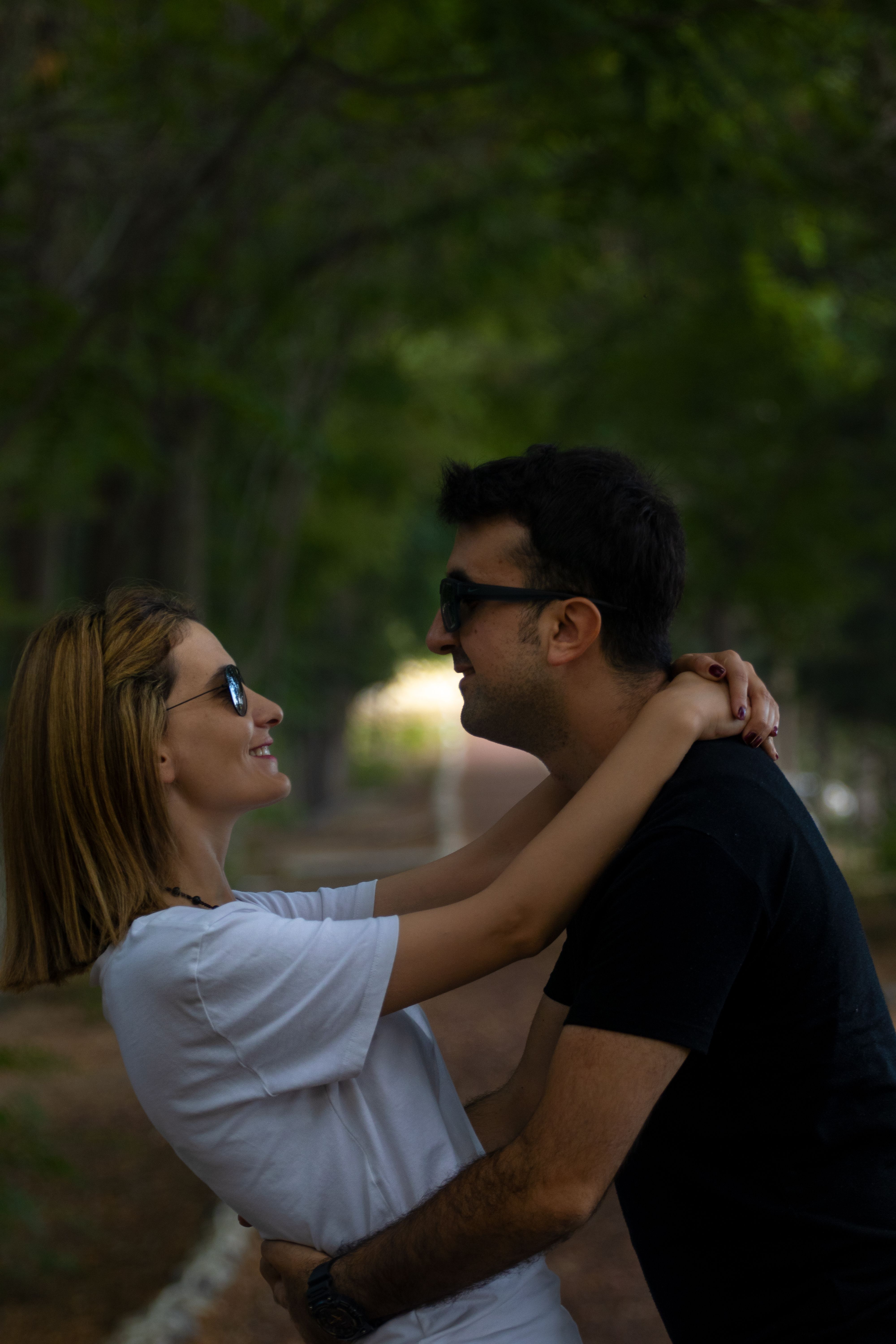 A Couple in Sunglasses Hugging Each Other · Free Stock Photo