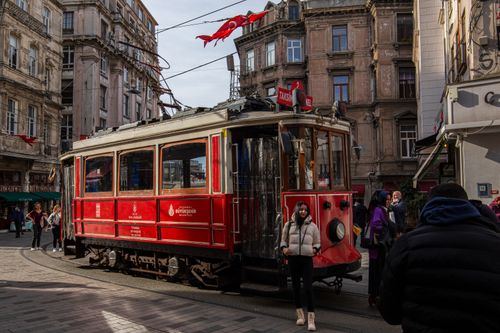 Free A red tram on İstiklal Avenue captures the bustling spirit of İstanbul. Stock Photo