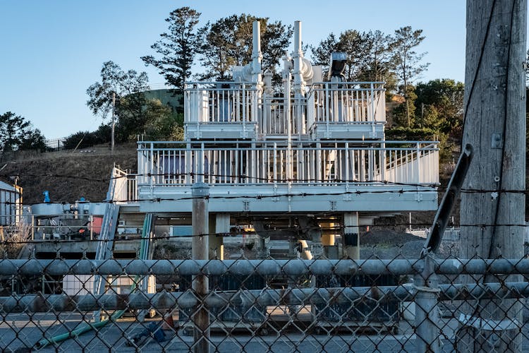 Metal Industrial Structure Behind A Fence