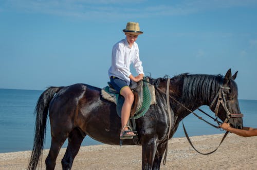 Boy Horseback Riding on the Beach 