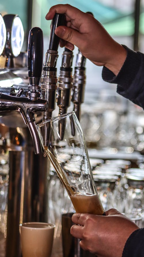 A Person Getting Beer from a Tap