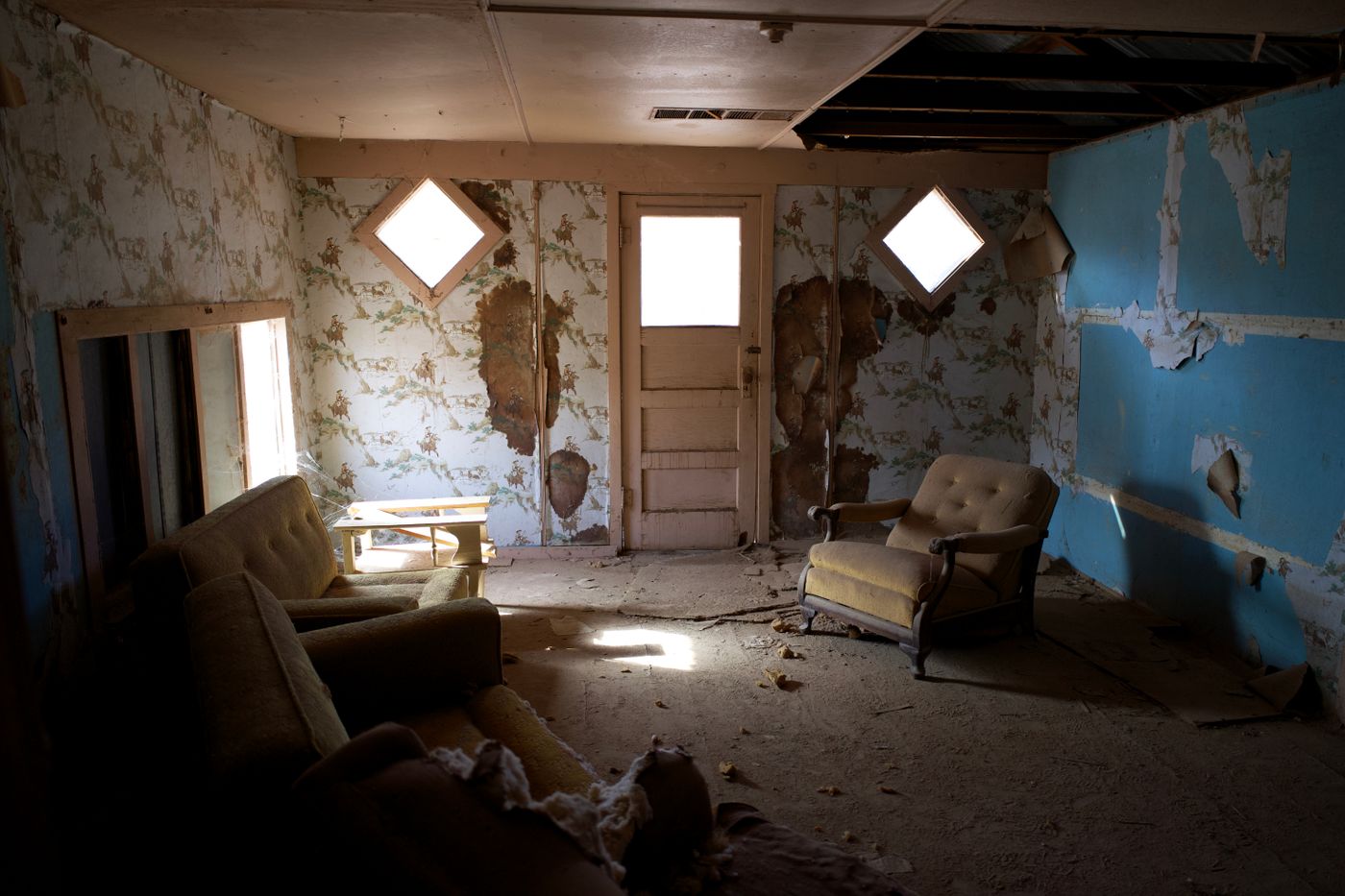 Sartell dining room before repaint — dated walls, original trim, pre-renovation residential interior