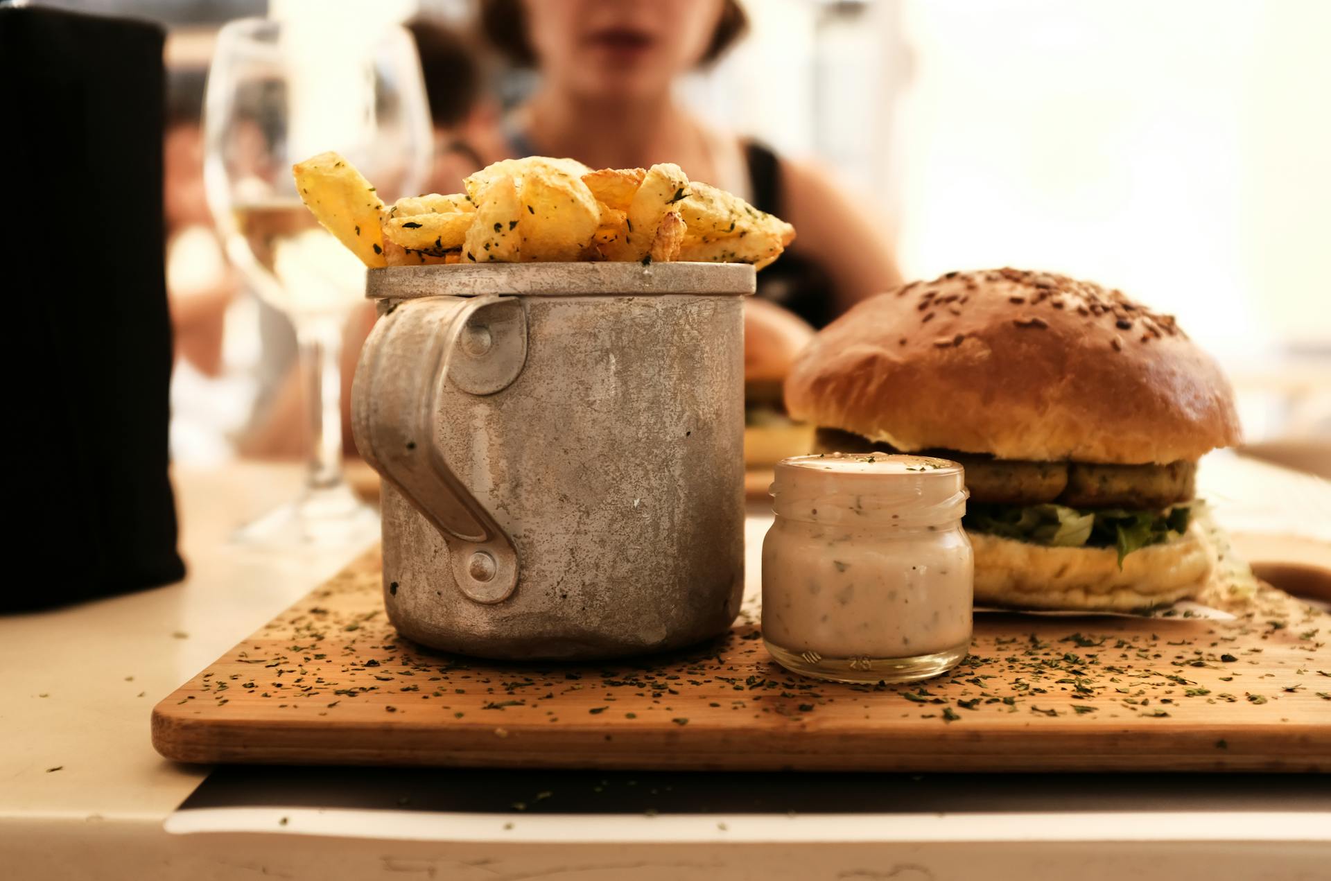 Shallow Focus Photography of Hamburger Beside Container