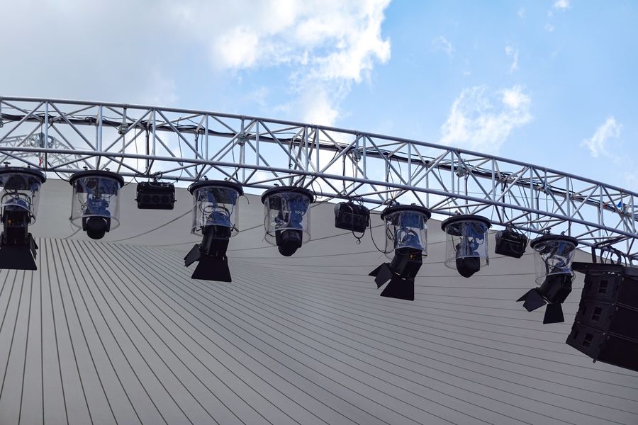 An outdoor stage rig against the sky