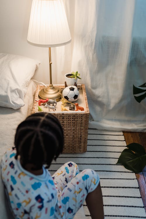 Free Girl Sitting on Bed Stock Photo