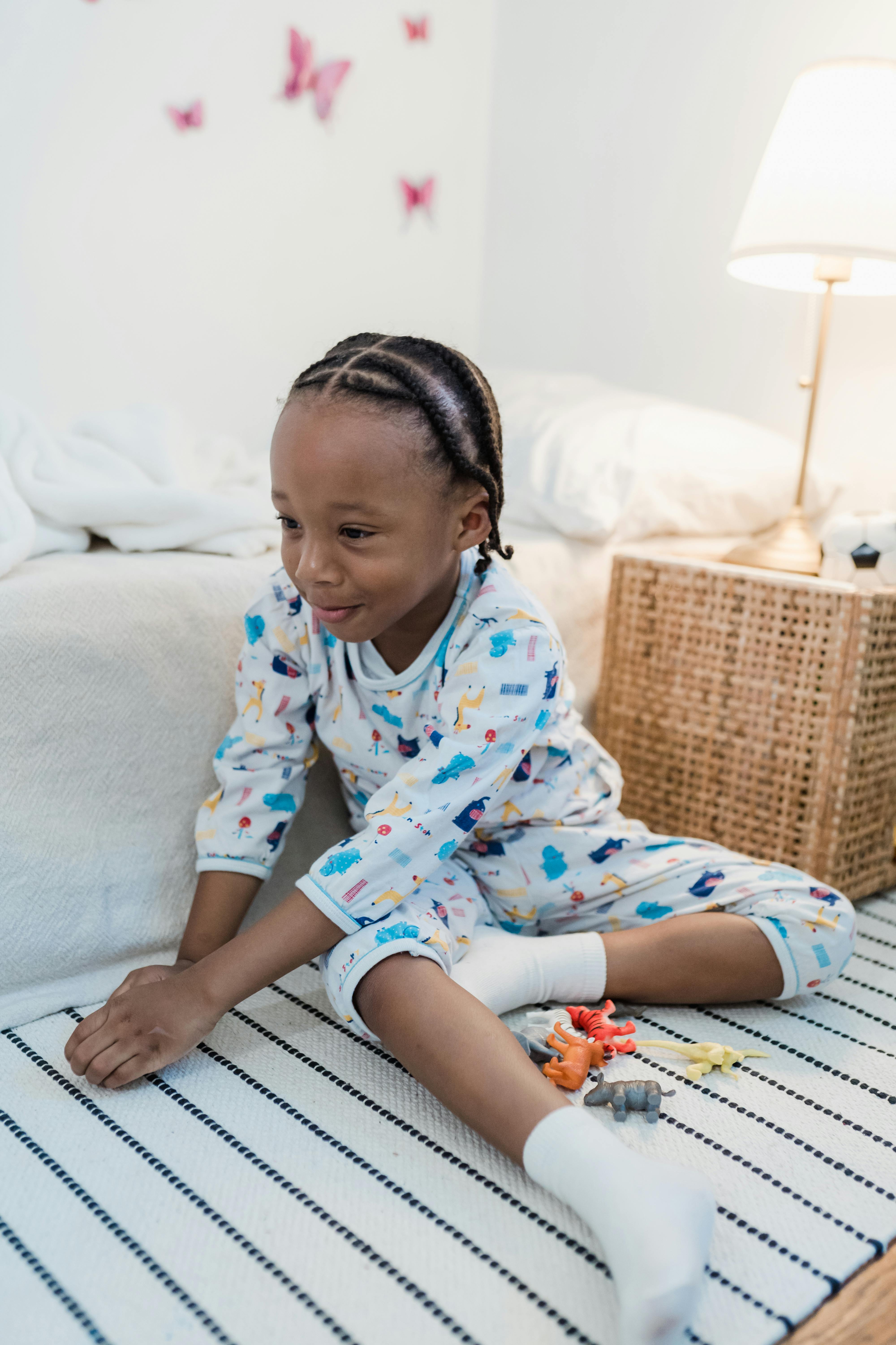 girl sitting on carpet in bedroom