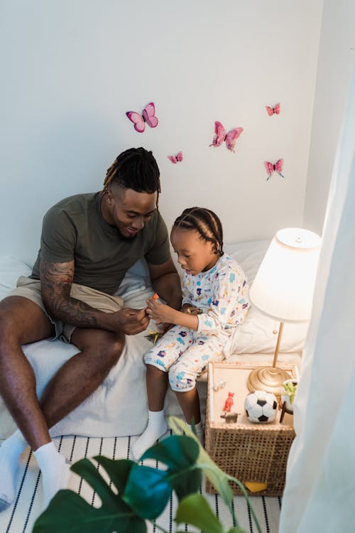 Free Father and Son Playing with Toys in the Child Room  Stock Photo