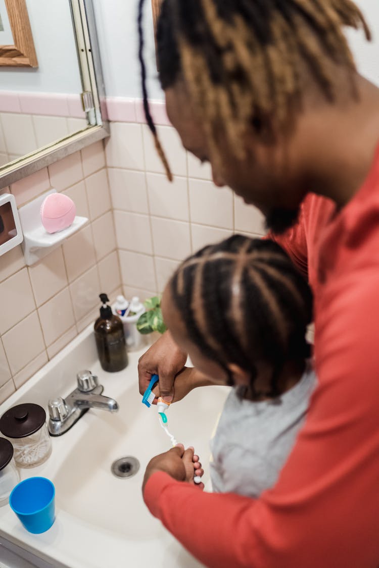 Father And Son Brushing Teeth 