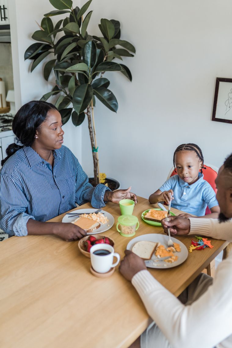 A family sharing breakfast around a kitchen table — photo by Mizuno K on Pexels