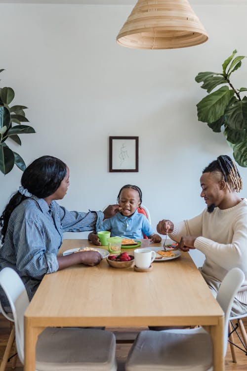 Family During a Meal in a Dining Room 