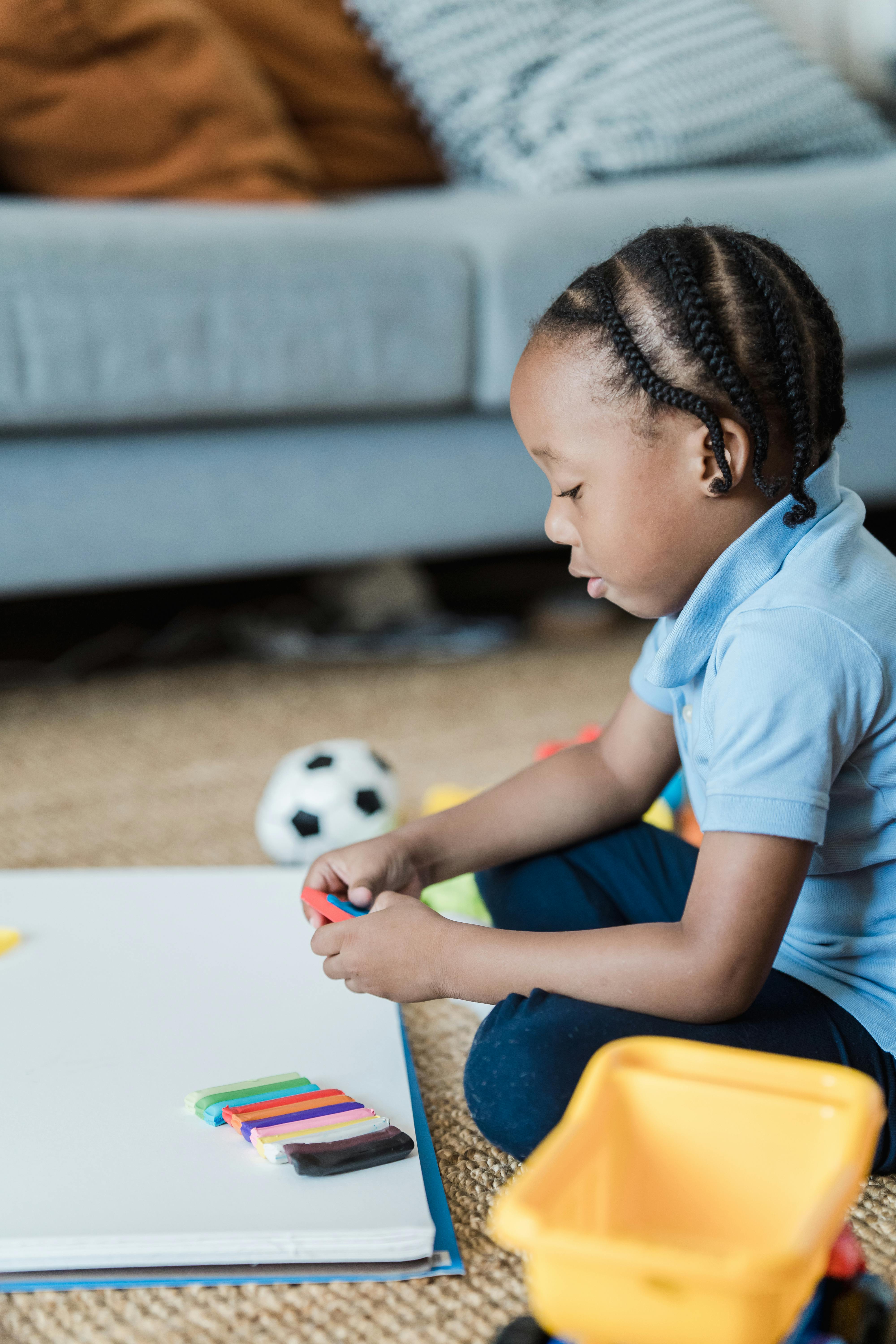 boy playing with plasticine