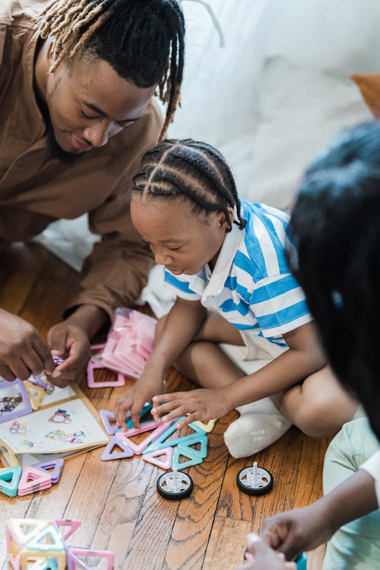 Little Kid Playing With Parents