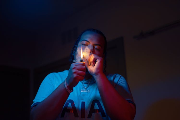 Man Lighting A Cigarette