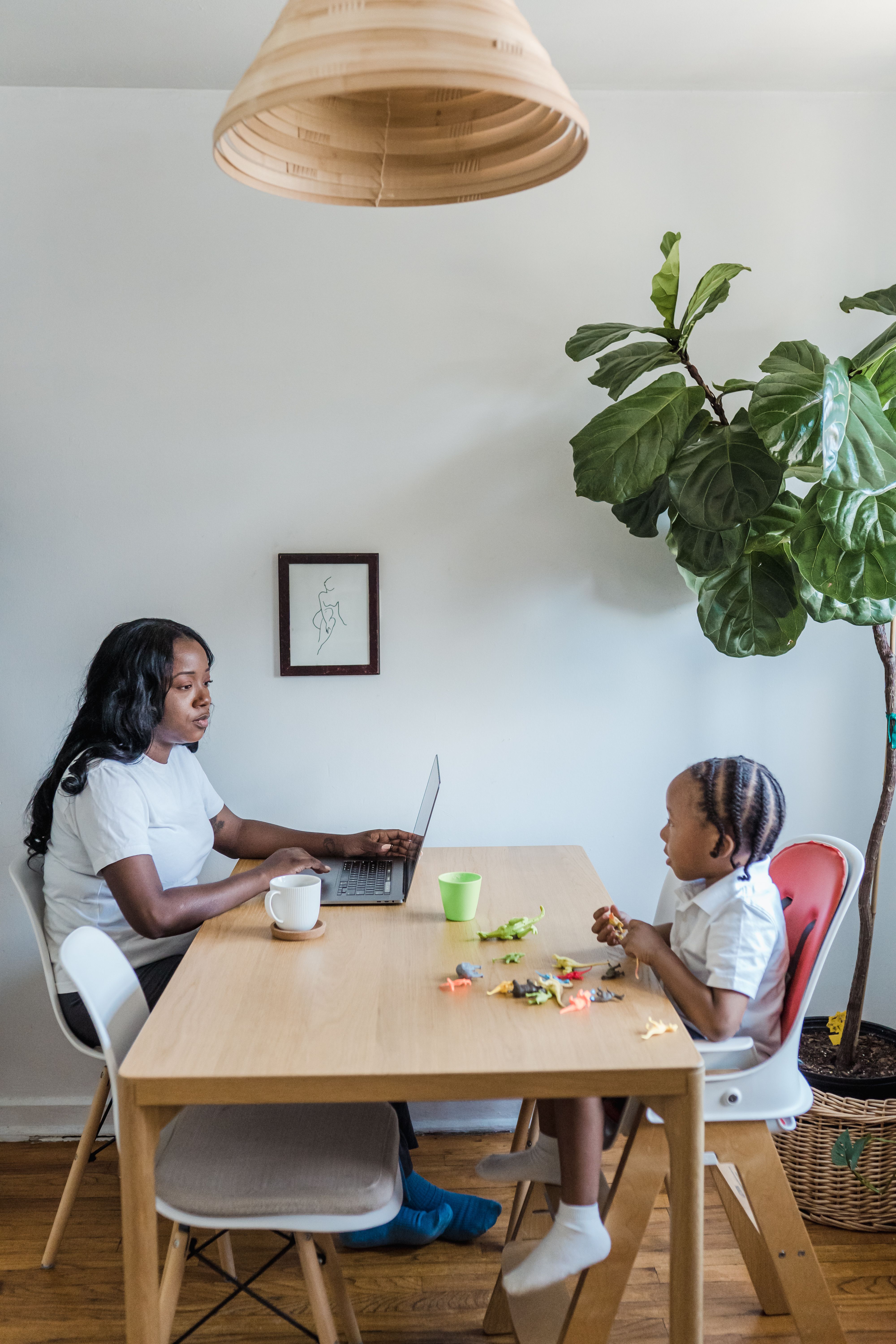 AI Mom Boss — a mother building her business from home, her child in her lap