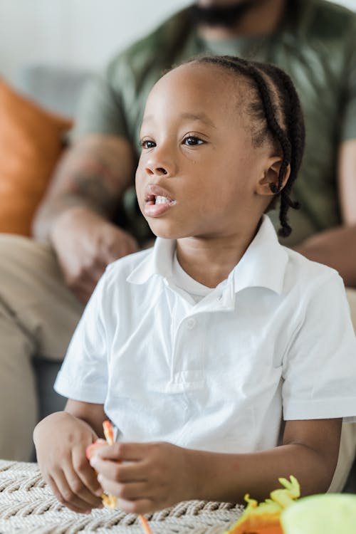 Portrait of Little Girl Watching TV