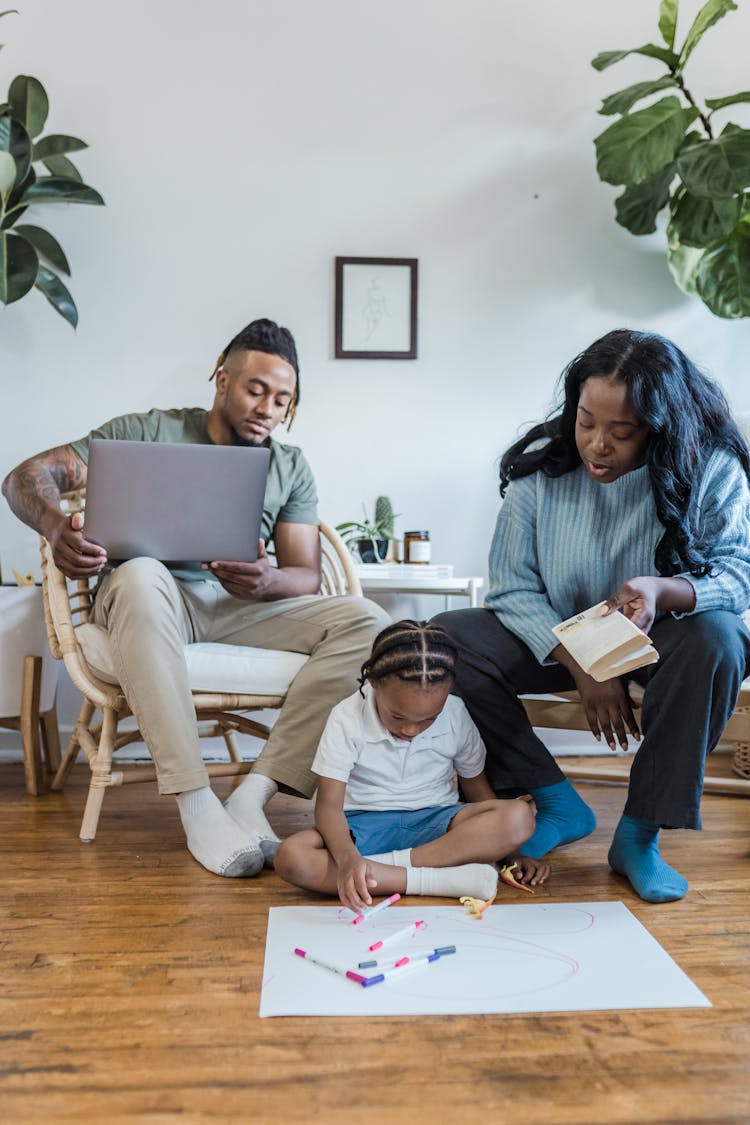 Family Relaxing Together In Living Room