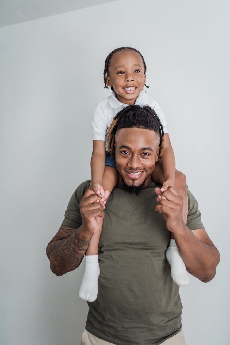 Father Giving Daughter Piggyback Ride