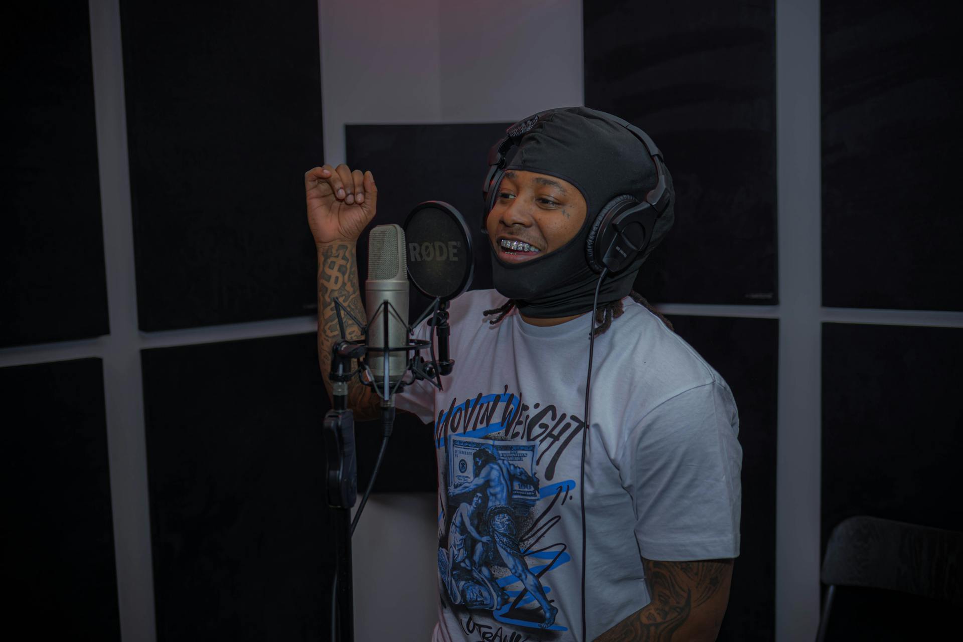 Smiling Man in Balaclava in Recording Studio