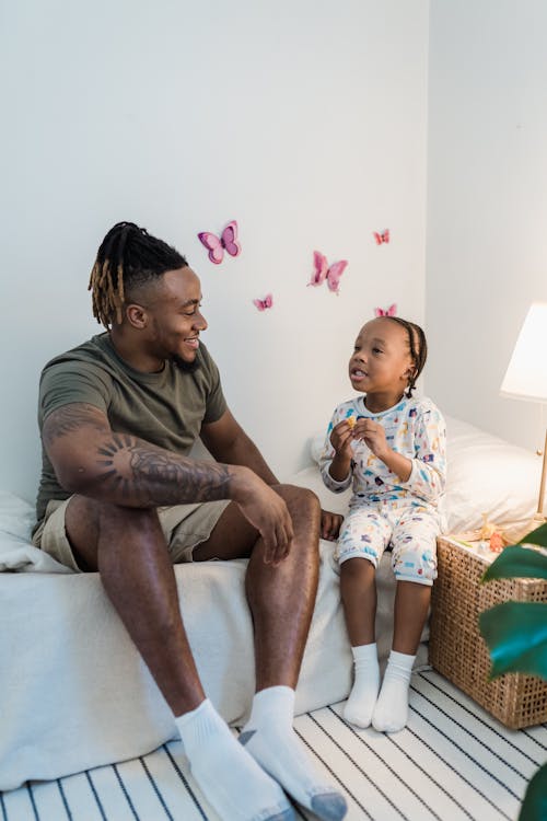 Free Father and Daughter Talking Before Bedtime Stock Photo
