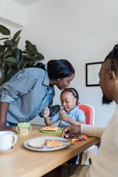 A loving family enjoying a meal and bonding in their kitchen.