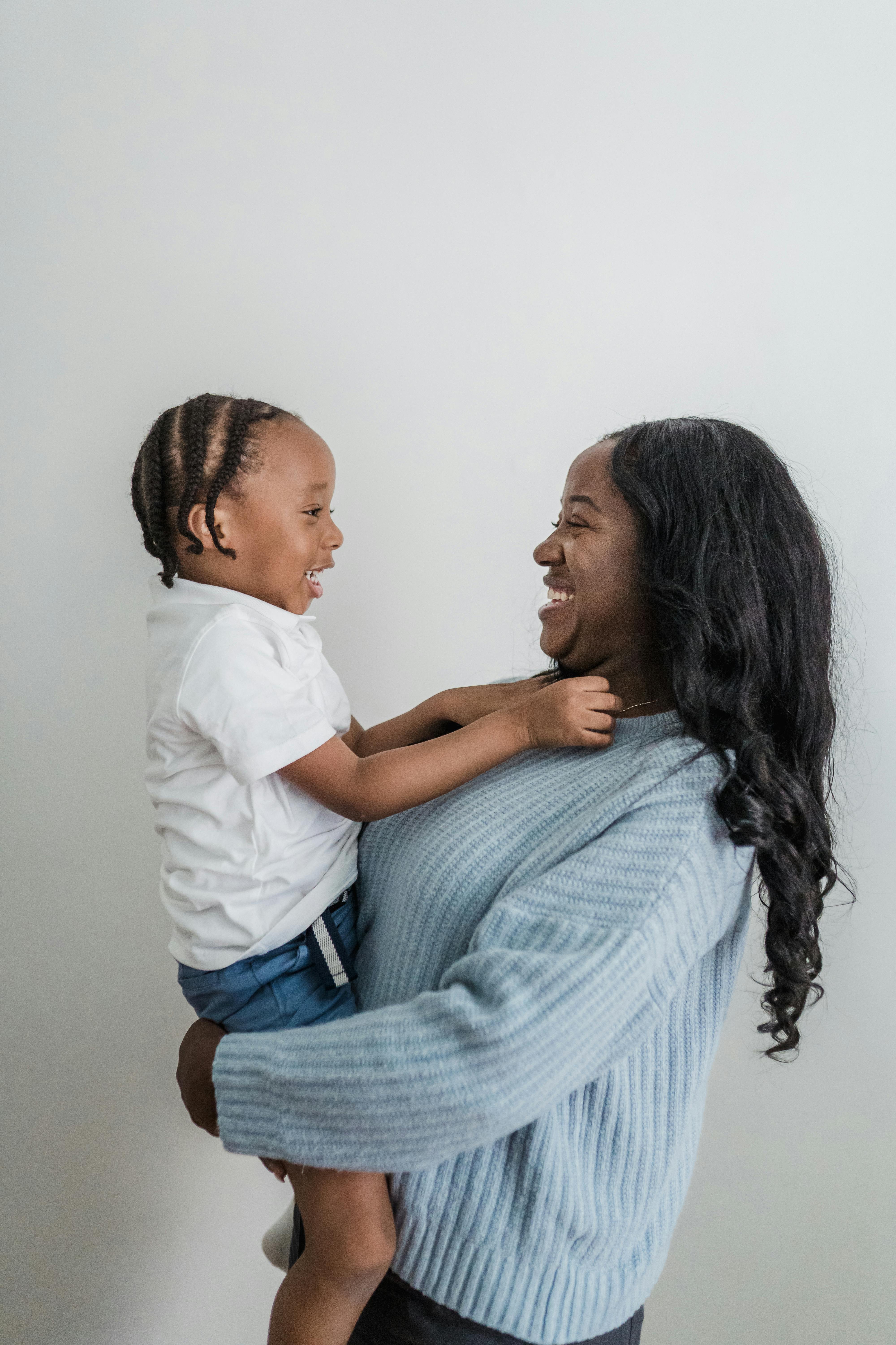 mother holding her son in her arms