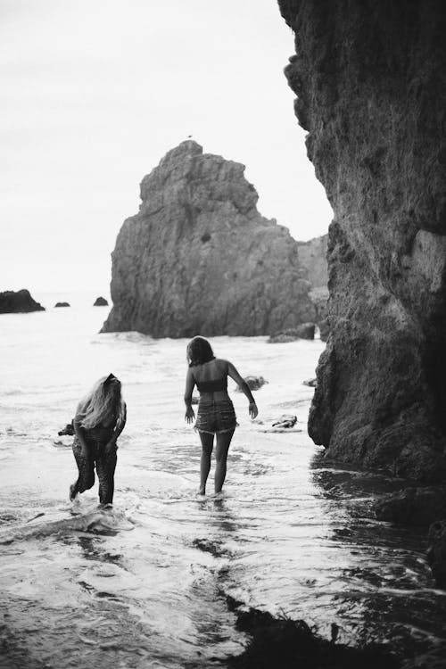 Two Women Walking in the Water