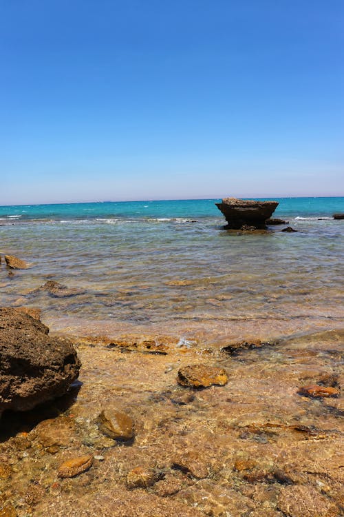 A Rocky Shore under a Clear Sky