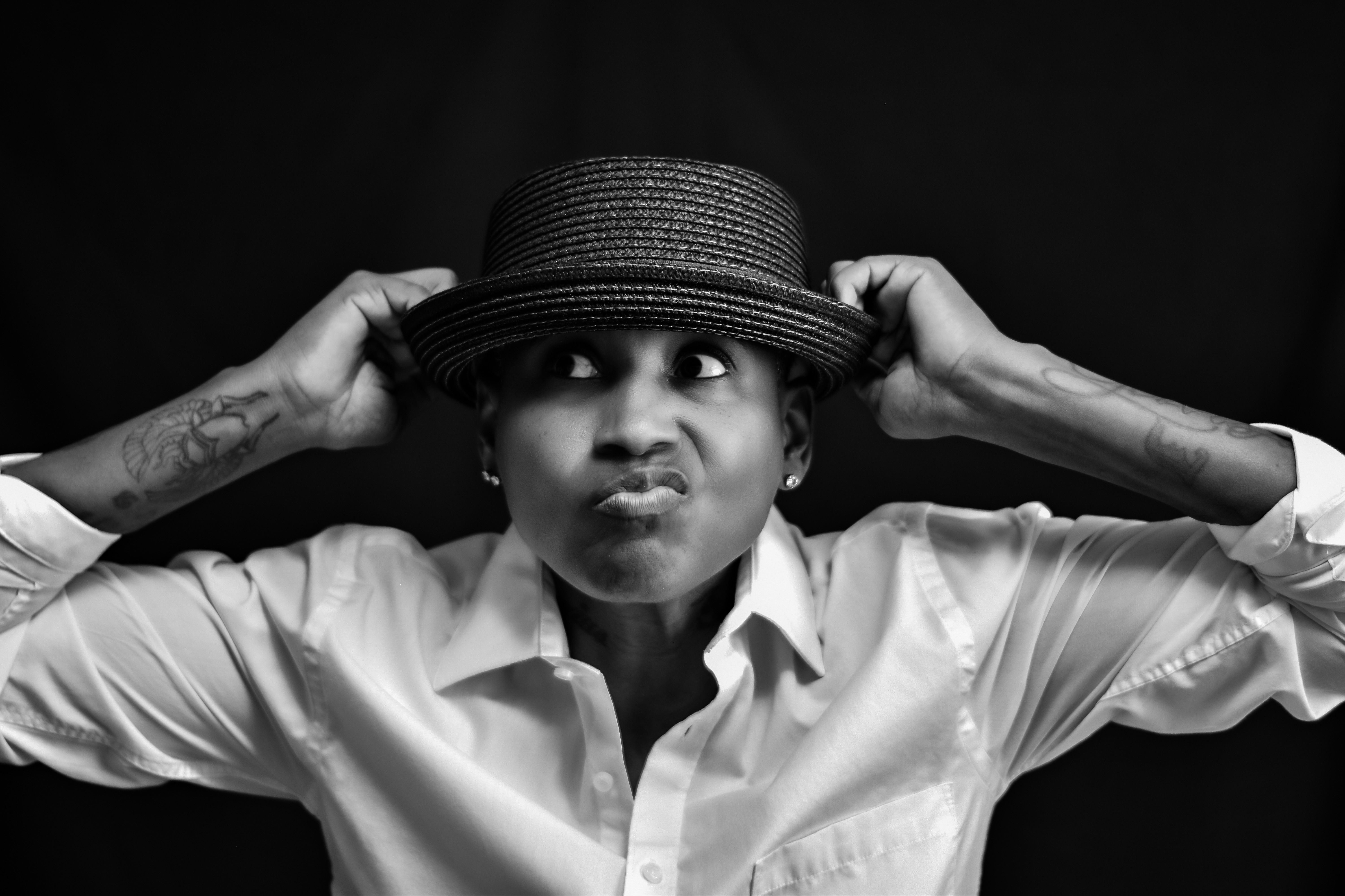A Grayscale of a Man with a Mustache Wearing a Hat · Free Stock Photo
