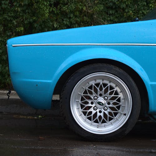 A Blue Vintage Car Parked on the Street