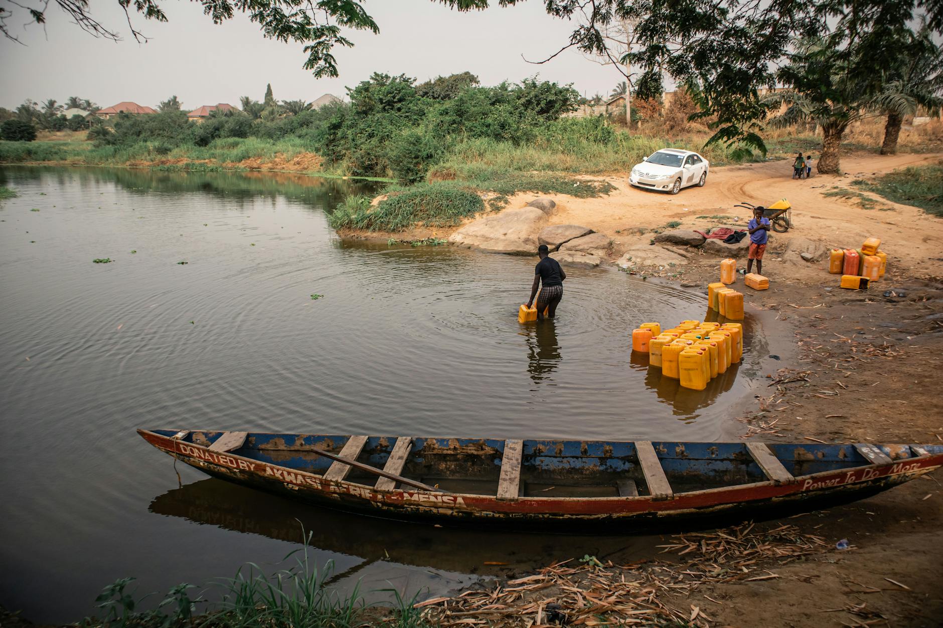 A Man Getting Water from the River