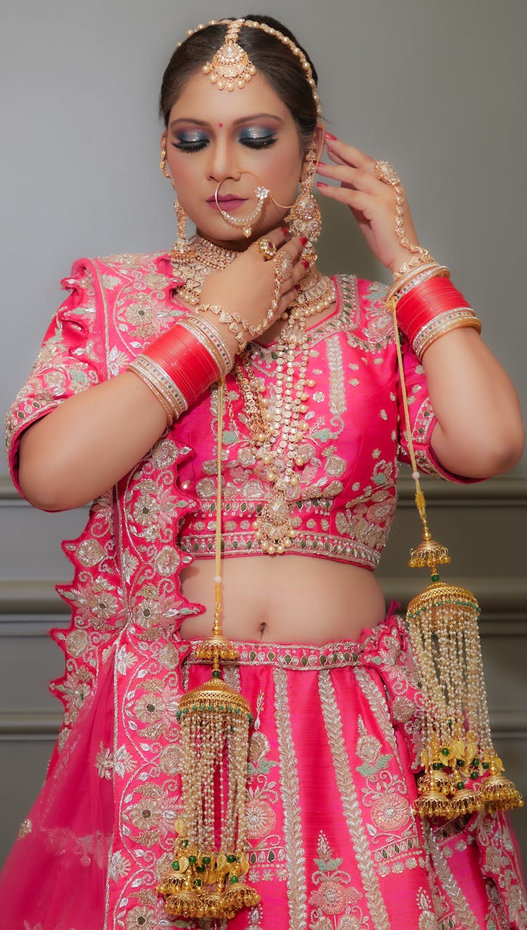 Woman Posing In Traditional Clothing With Jewelry