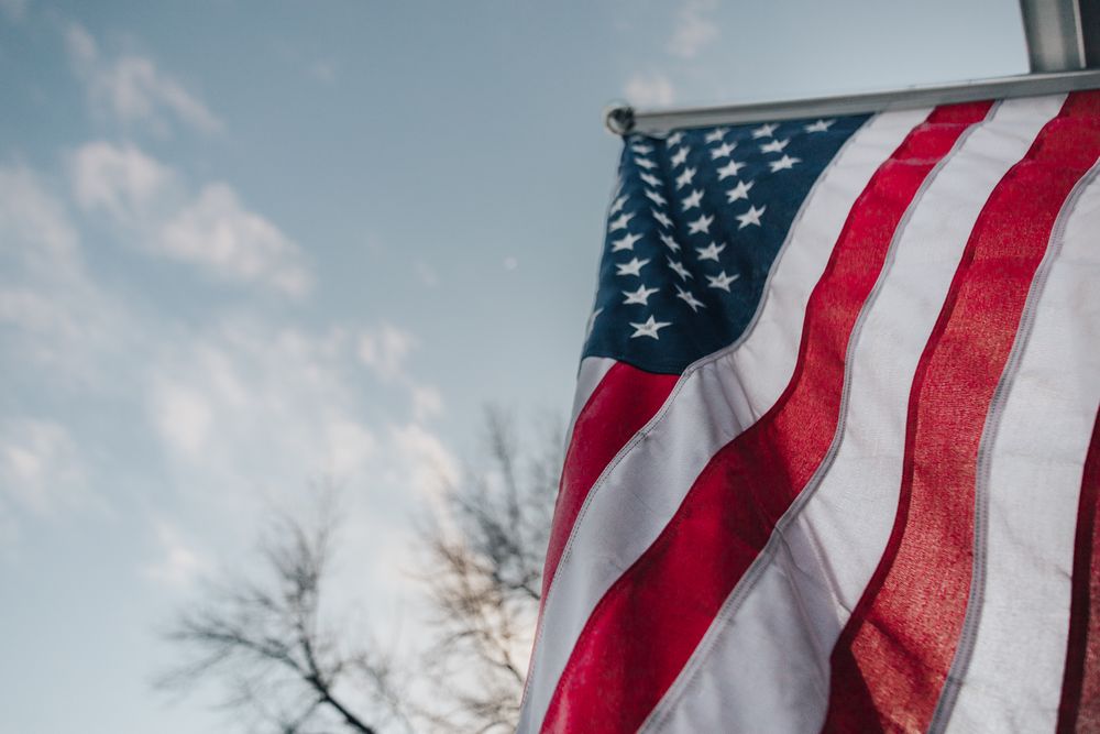 American flag waving against the sky