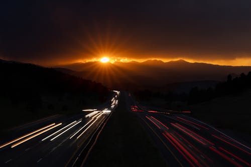 Time-Lapse Photography of Cars on the Road during Sunset