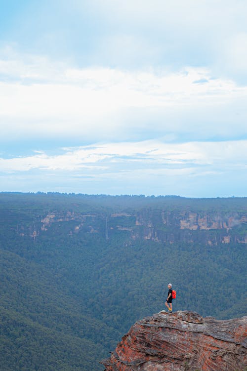 Person Standing on a Cliff