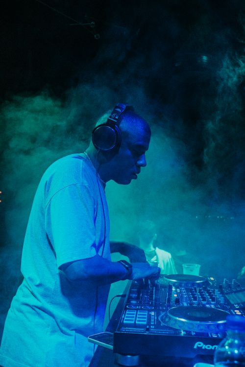 Example Dj A DJ Performing on the Stage · Free Stock Photo
