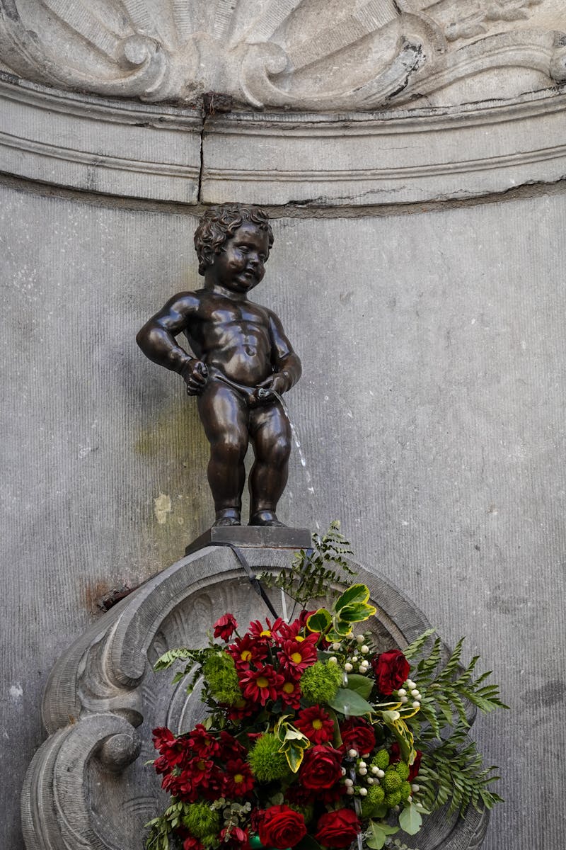 Statue of Man Holding Flower
